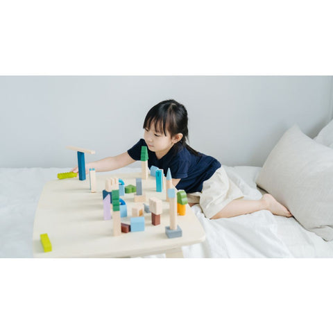 Kid playing PlanToys Urban City Blocks