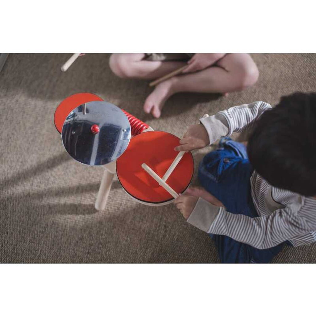 Kid playing PlanToys Musical Band