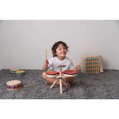 Kid playing PlanToys Musical Band