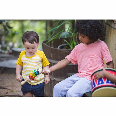 Kid playing PlanToys Clatter