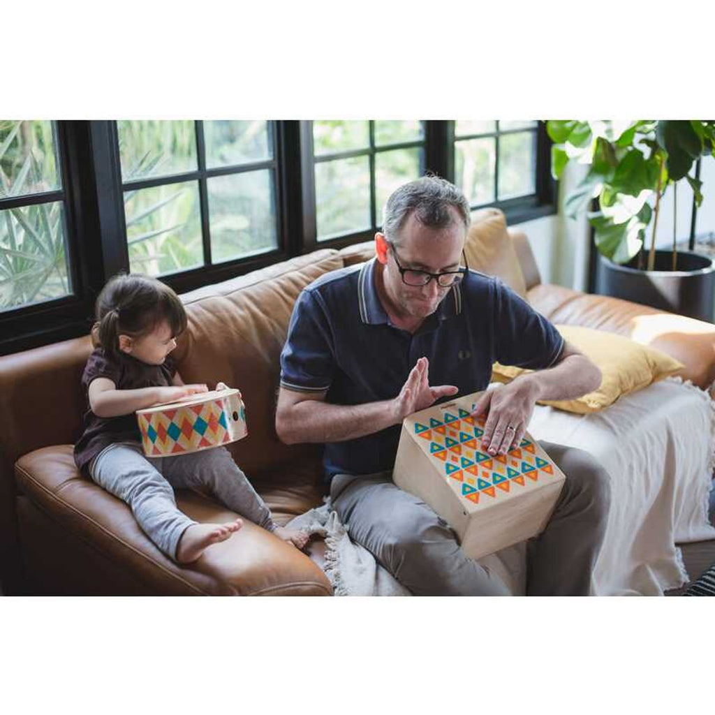 Kid playing PlanToys Rhythm Box