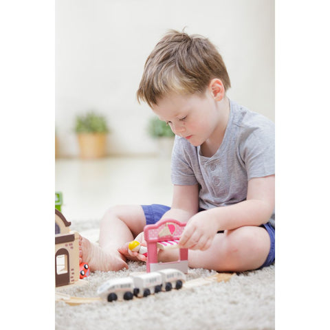 Kid playing PlanToys Ice Cream Shop