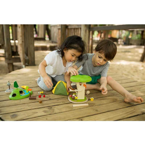 Kid playing PlanToys Tree House