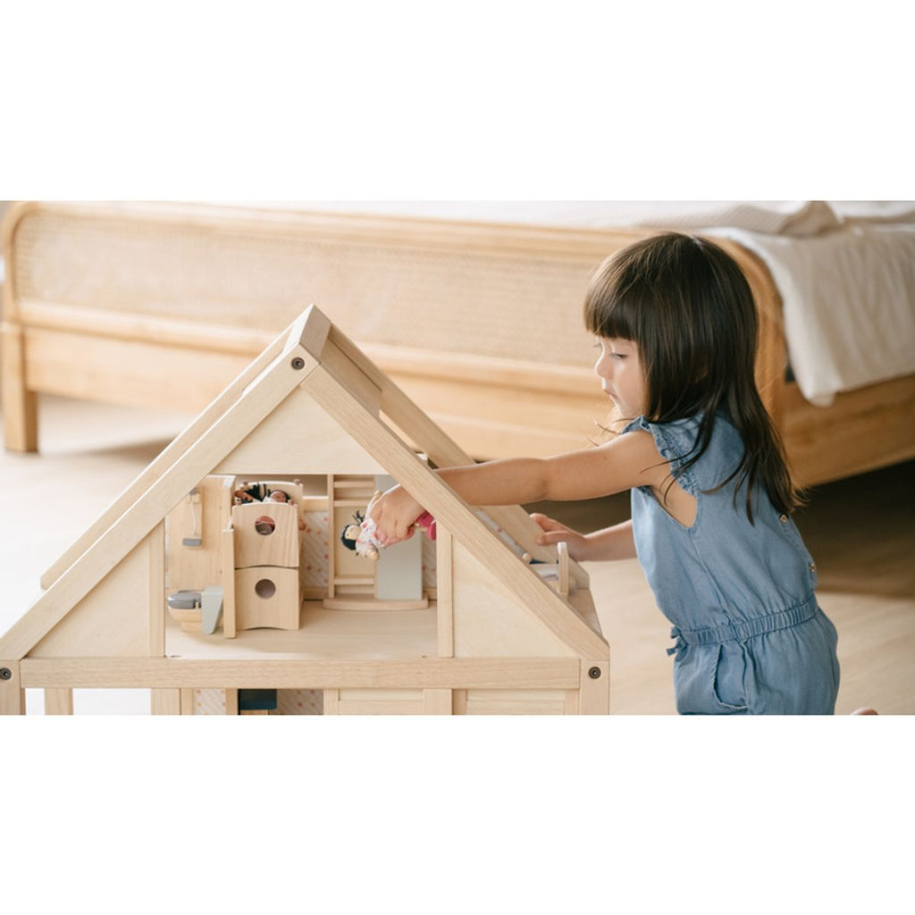 Kid playing PlanToys My First Dollhouse