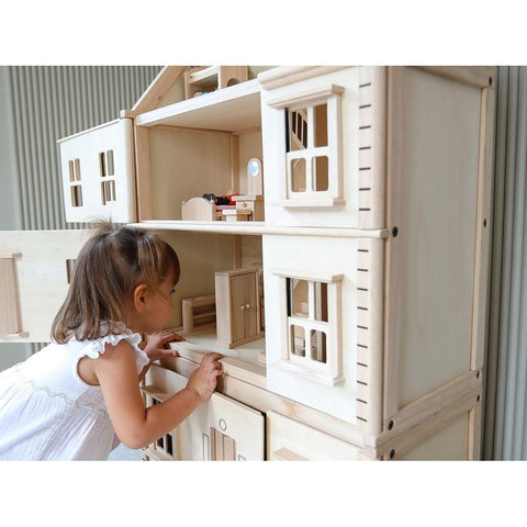 Kid playing PlanToys Victorian Dollhouse Basement Floor