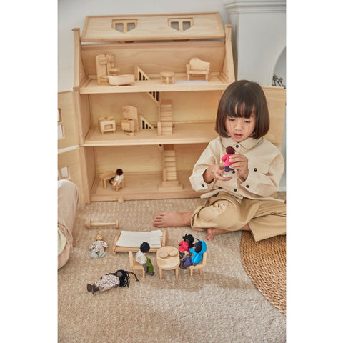 Kid playing PlanToys Victorian Furniture Set