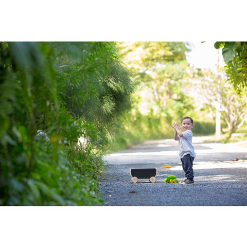 Kid using PlanToys Wagon - Black