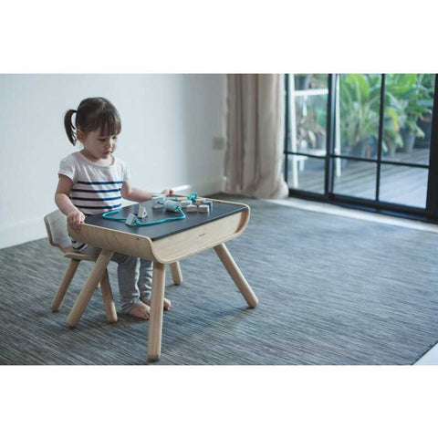 Kid using PlanToys Table & Chair - Black