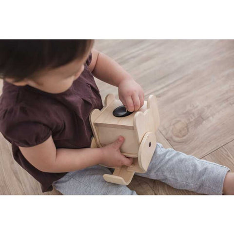 Kid using PlanToys Elephant Bank