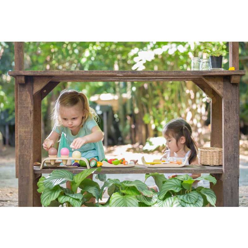 Kid playing PlanToys Assorted Fruit & Vegetable