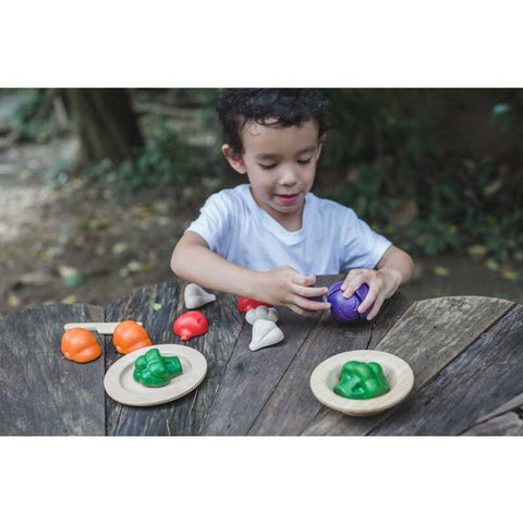 Kid playing PlanToys 5 Colors Veggie Set