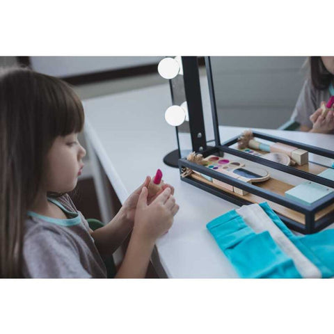 Kid playing PlanToys Make Up Set