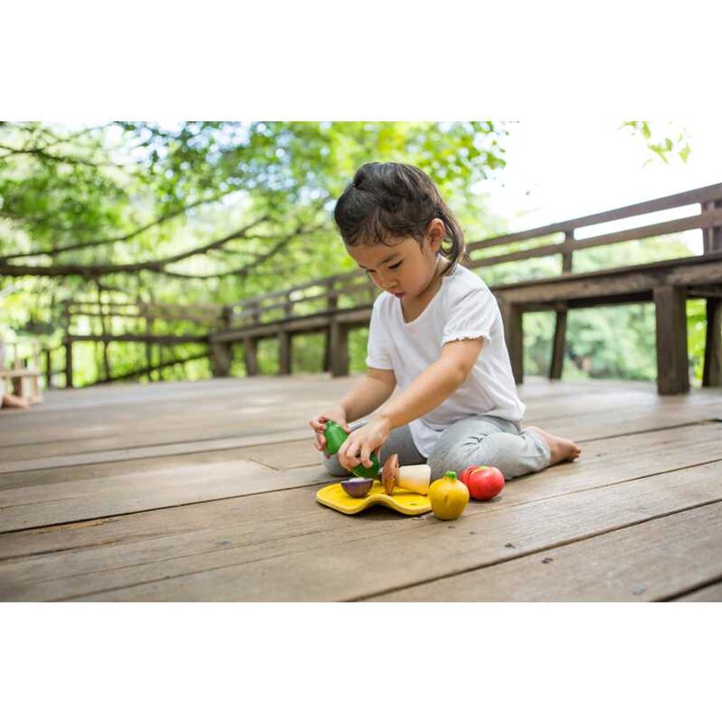 Kid playing PlanToys Assorted Vegetables Set