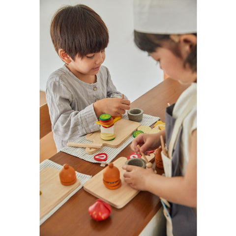 Kid playing PlanToys Cheese & Charcuterie Board