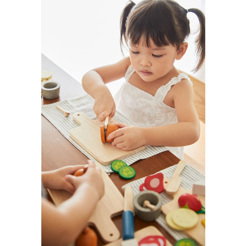 Kid playing PlanToys Cheese & Charcuterie Board