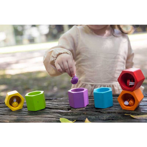 Kid playing PlanToys Beehives