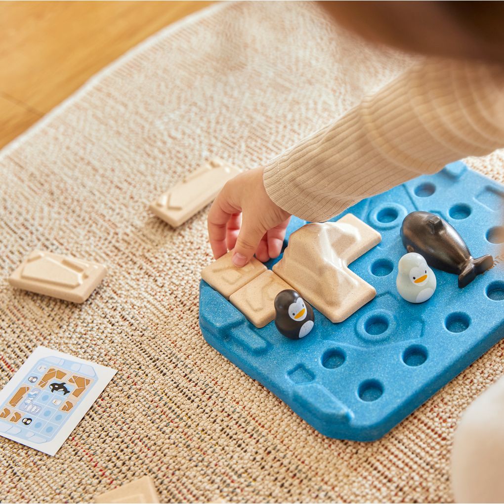 Kid playing PlanToys Finding Penguin Game