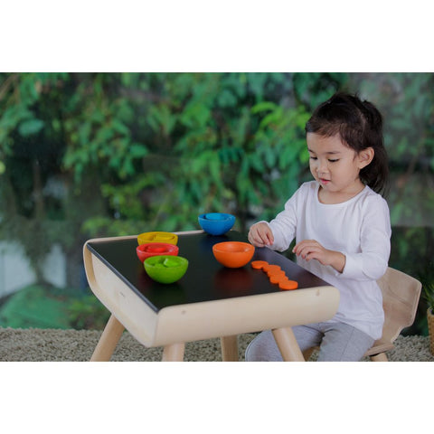 Kid playing PlanToys Sort & Count Cups