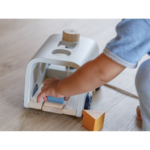 Kid playing PlanToys Sorting Bus - Orchard Series