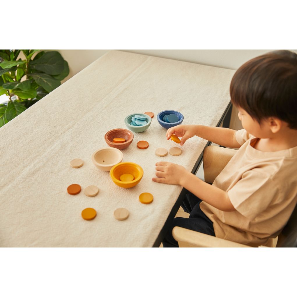 Kid playing PlanToys Sort & Count Cups - Orchard