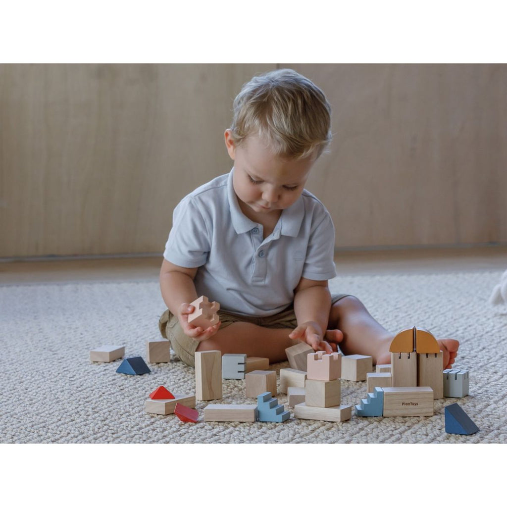 Kid playing PlanToys Creative Blocks - Orchard Series