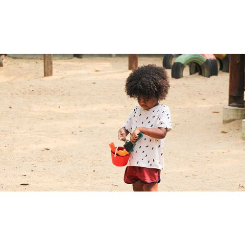 Kid playing PlanToys Sand Play Set