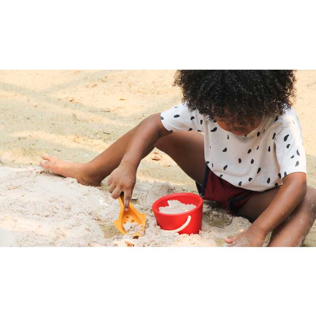 Kid playing PlanToys Sand Play Set