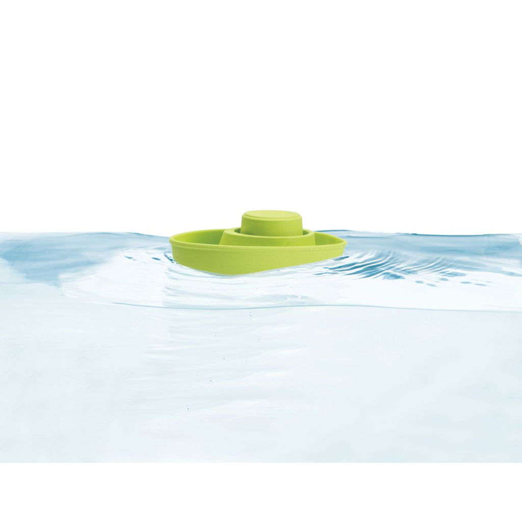 Kid playing PlanToys Rubber Convertible Boat – Pastel Green