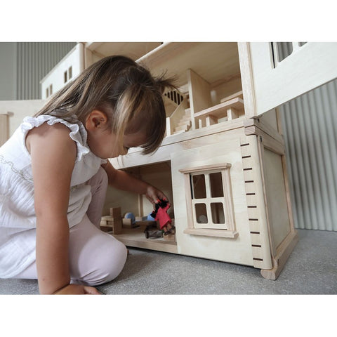 Kid playing PlanToys Victorian Dollhouse Basement Floor