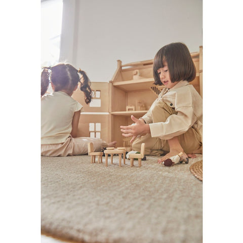 Kid playing PlanToys Victorian Furniture Set